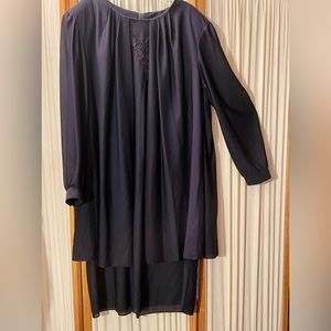 Classy dress with attractive jacket attached.